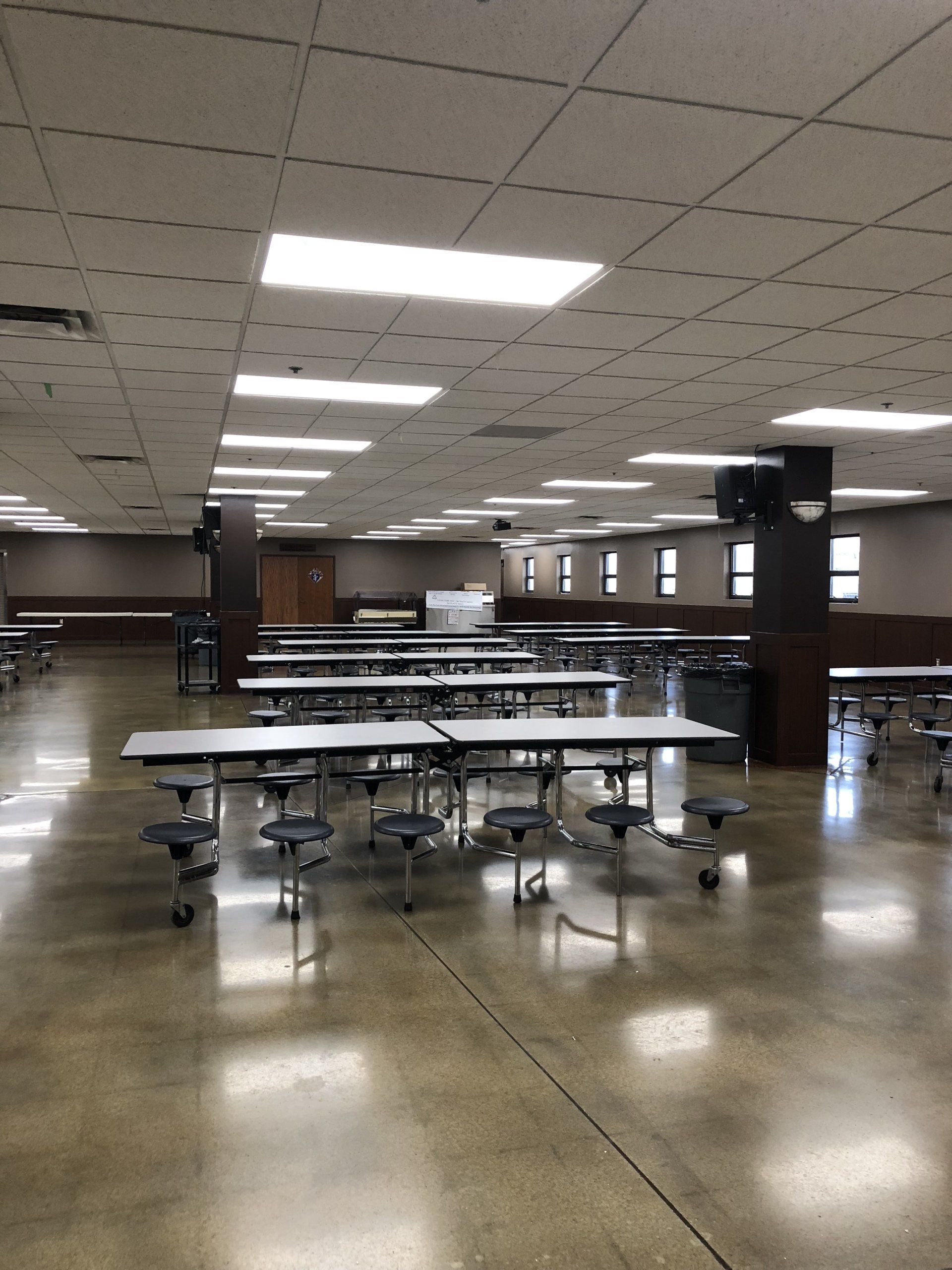 A large room with tables and chairs in it