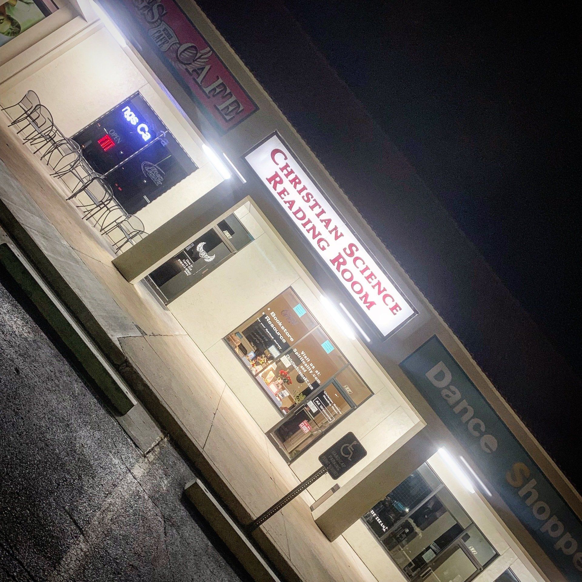 A building with a sign that says christian science reading room