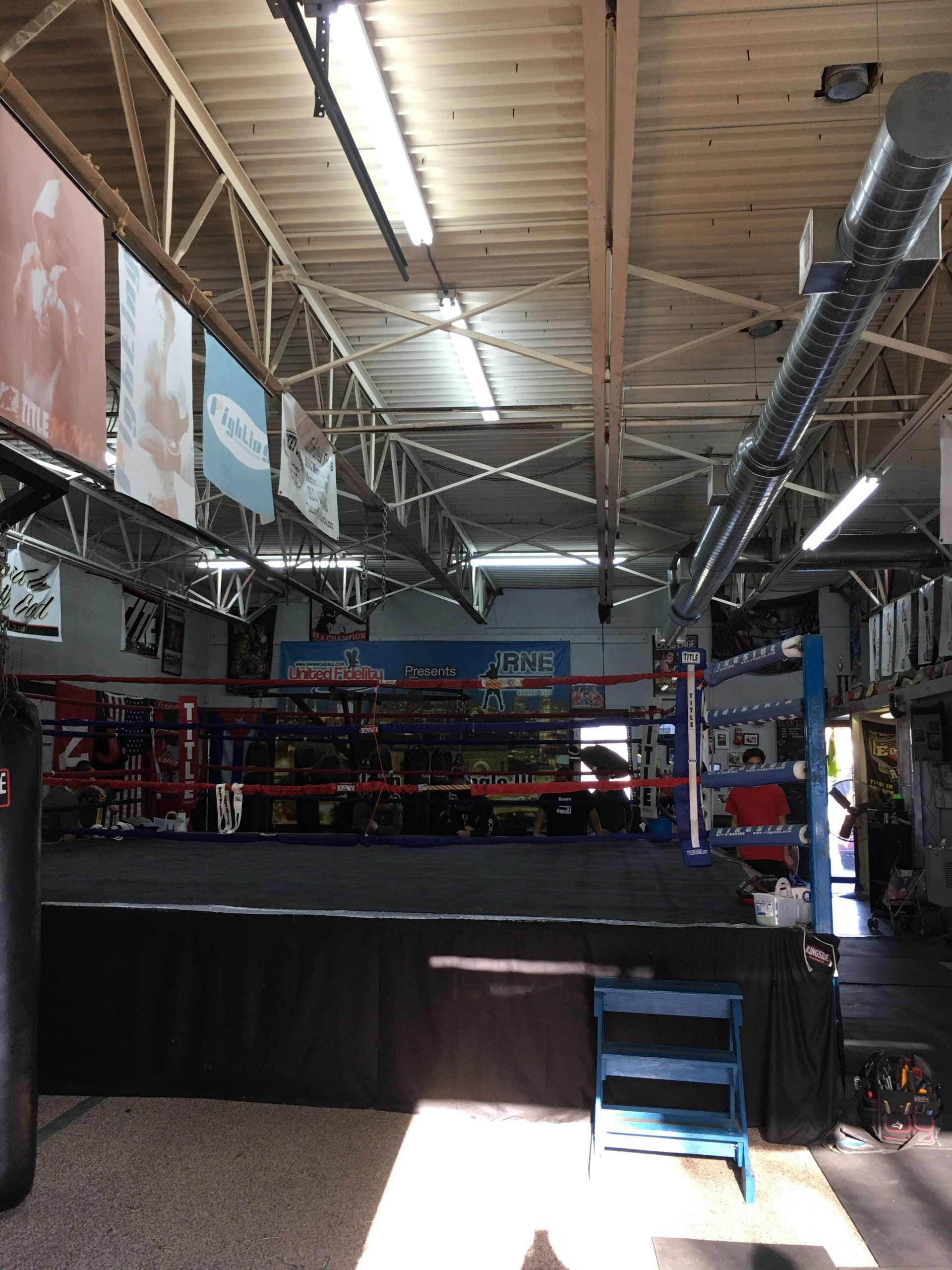 A boxing ring with a chair in the middle of it