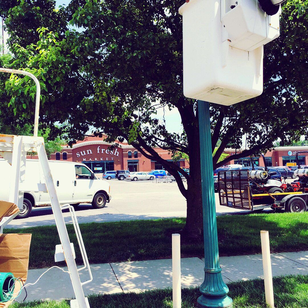 A white van is parked in front of a store called cotton fresh