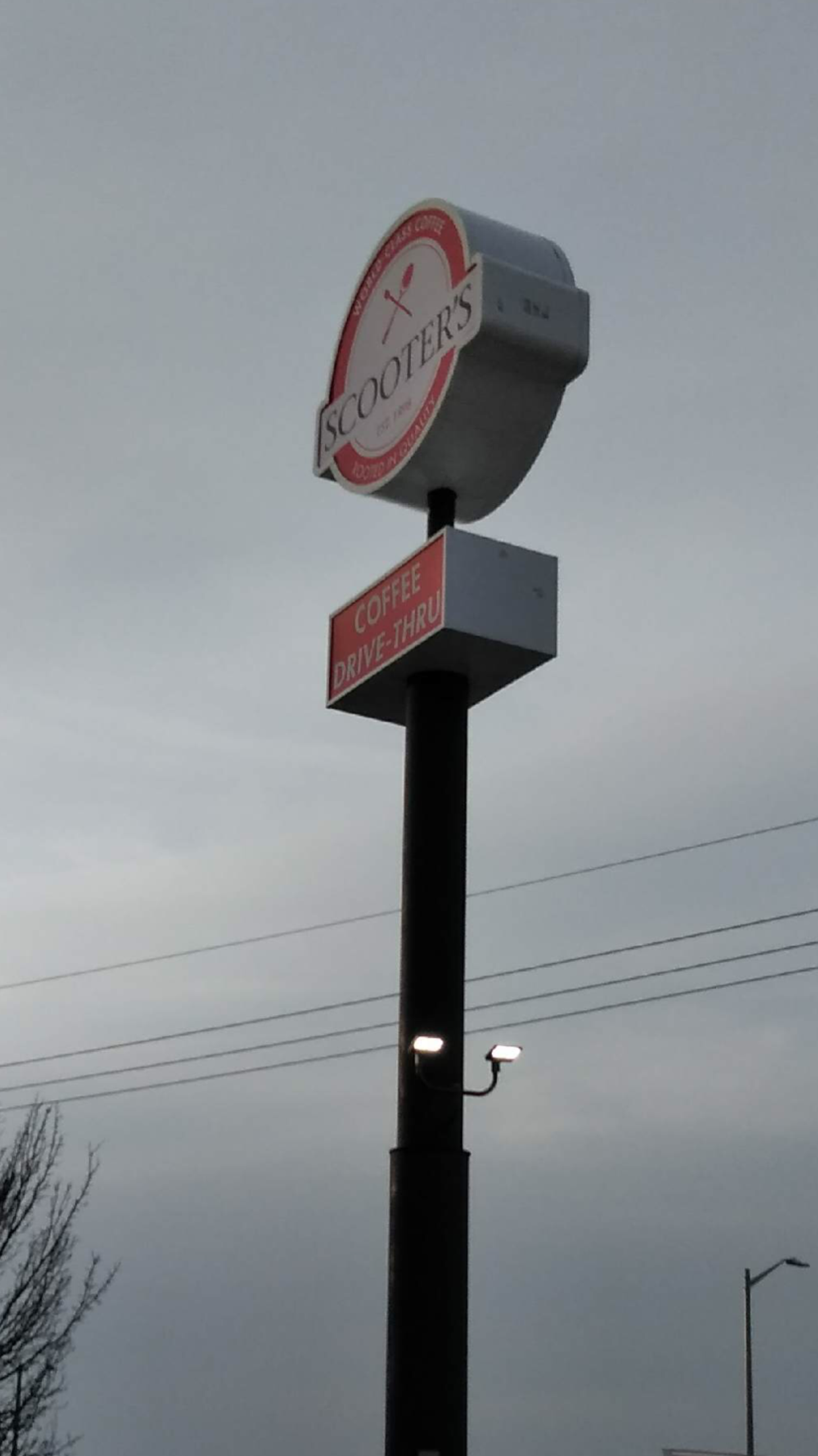 A clock on a pole that says 7:30 on it