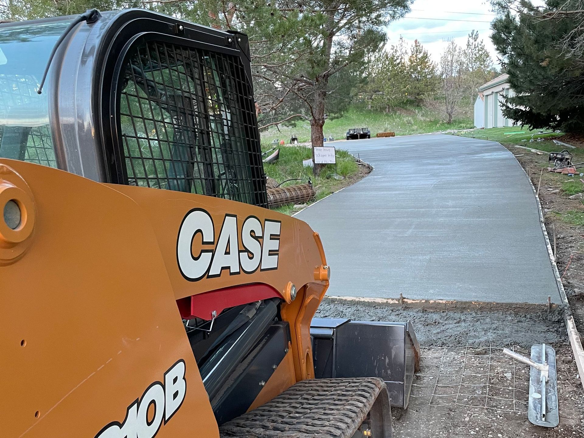 A case tractor is parked on the side of a road