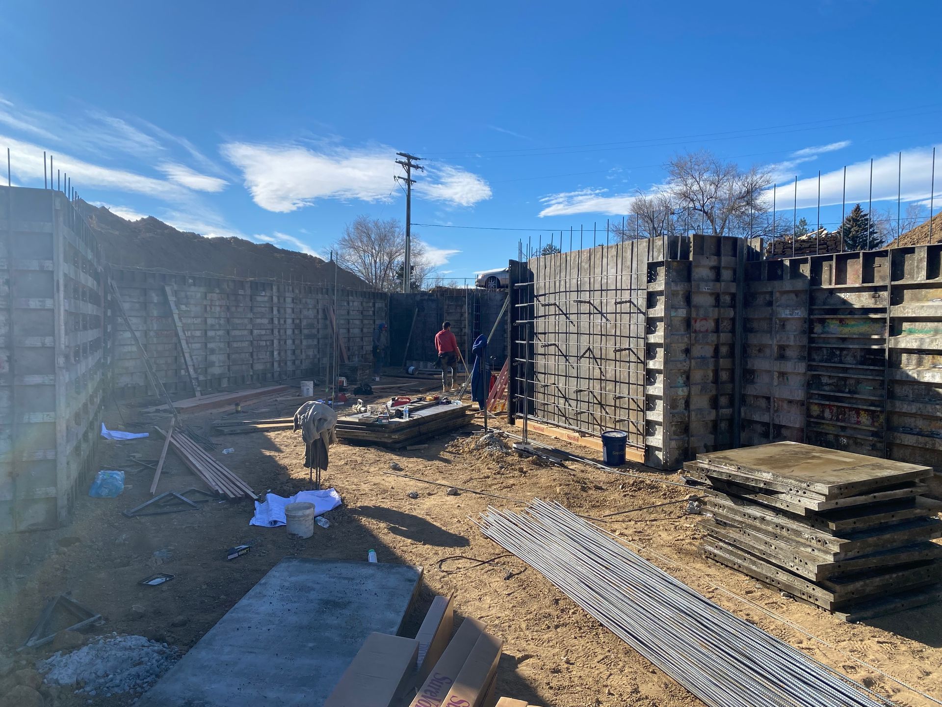 A construction site with a lot of concrete walls being built.