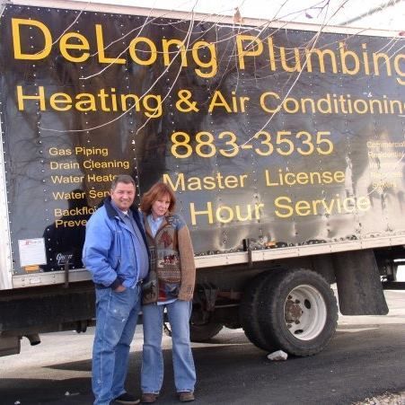 A bunch of trucks are parked on the side of the road.