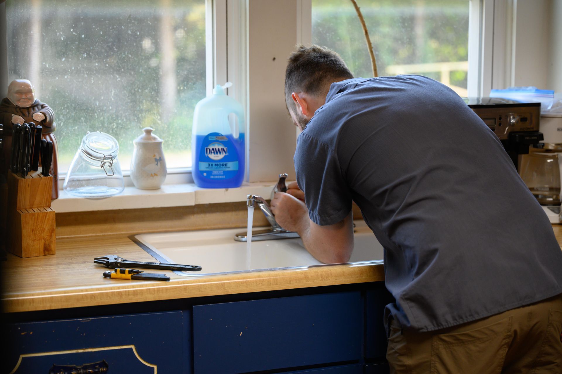 A field of tall grass with a sunset in the background