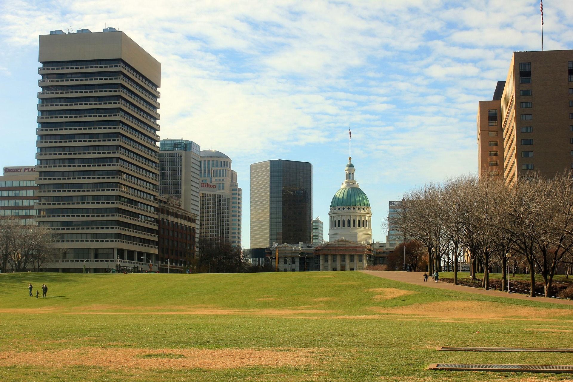 A city skyline with a green dome in the middle