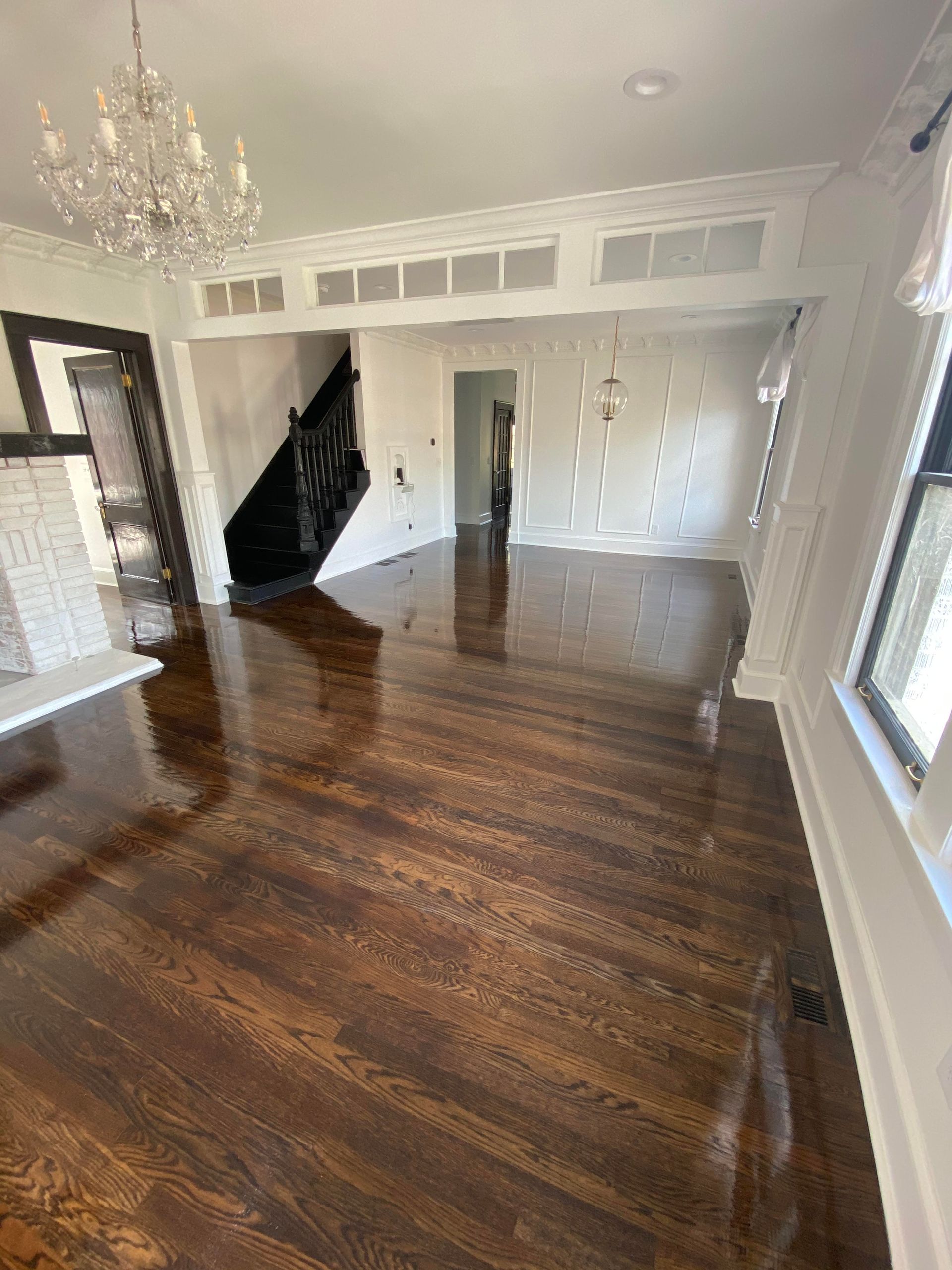 A living room with brown hardwood floors