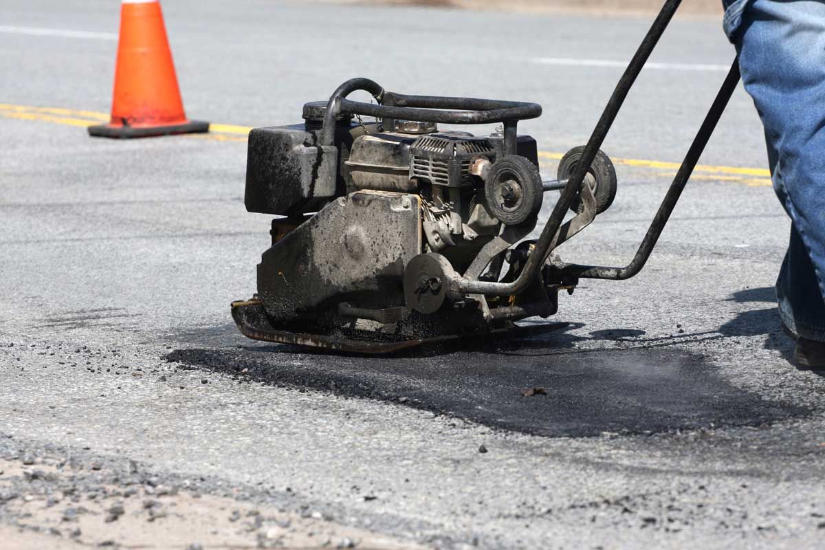 Road Worker Using a Paver | Twin Falls, ID | A & J Paving and Sealcoating