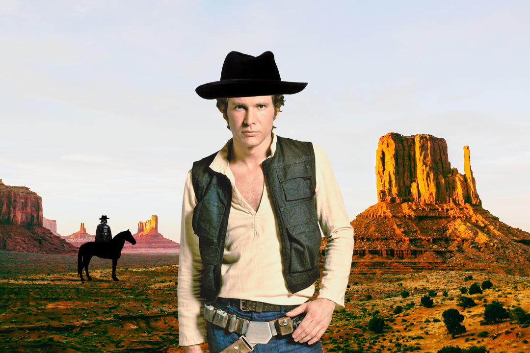 A man in a cowboy hat is standing in the desert with a man on a horse in the background.