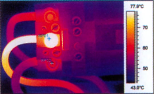 A thermometer shows a temperature of 77 degrees celsius