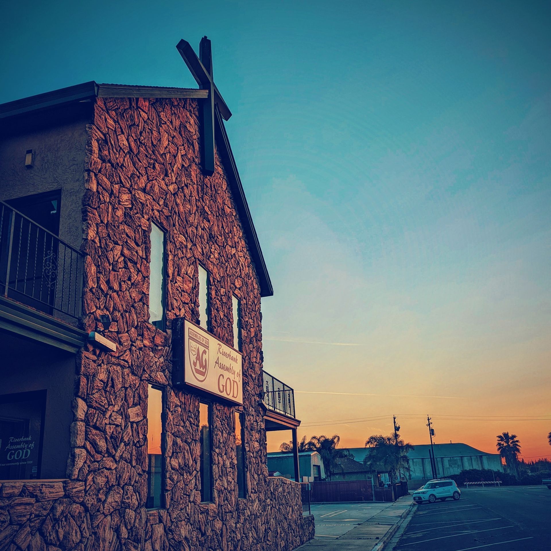 A large stone building with a sign on the side that says occ