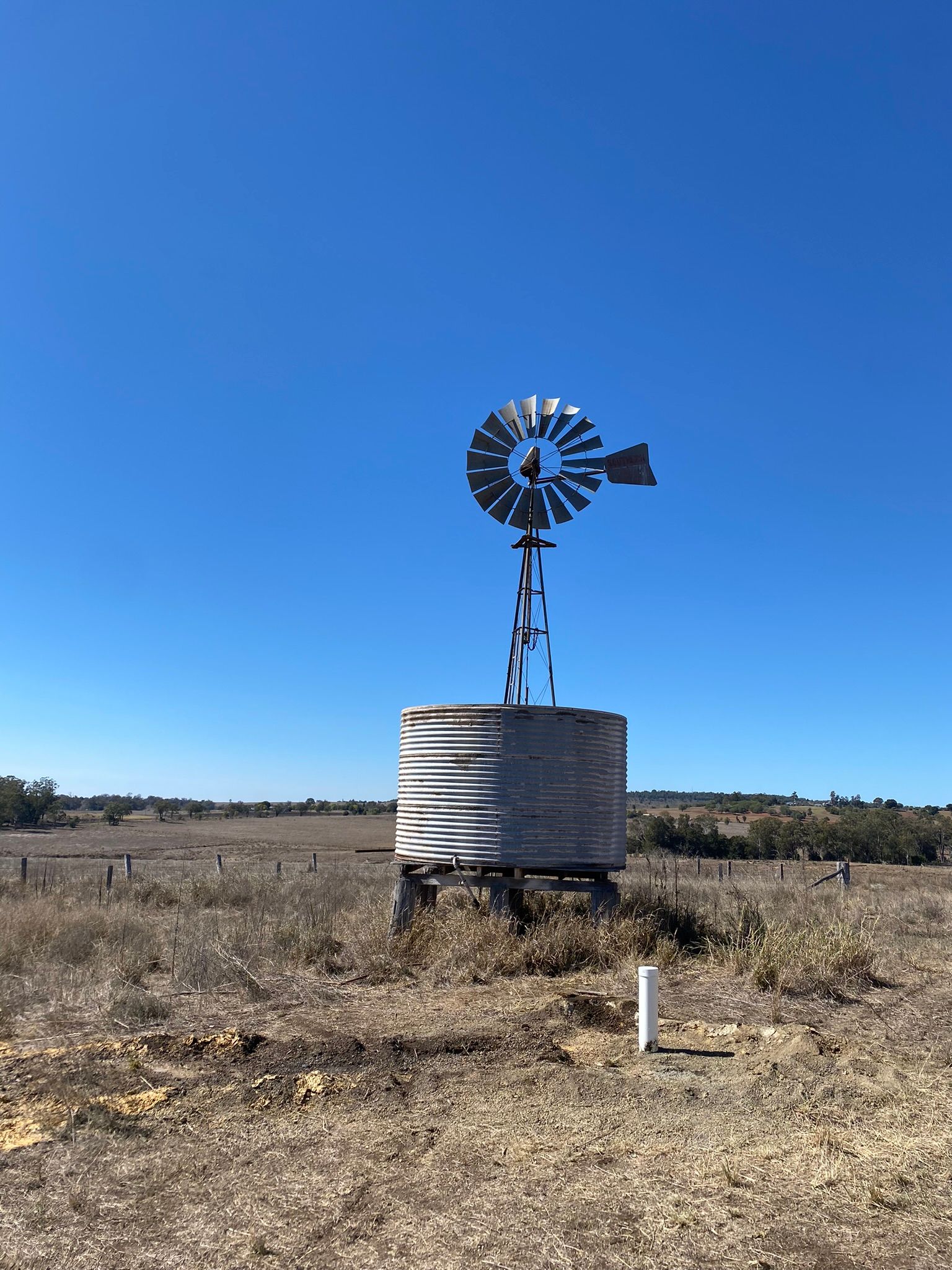 Finished bore with tank and windmill in background