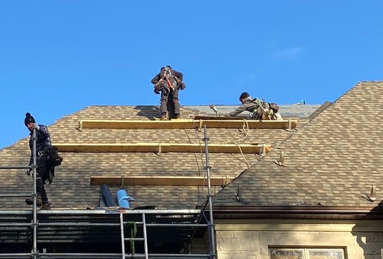 Experts working on a roof