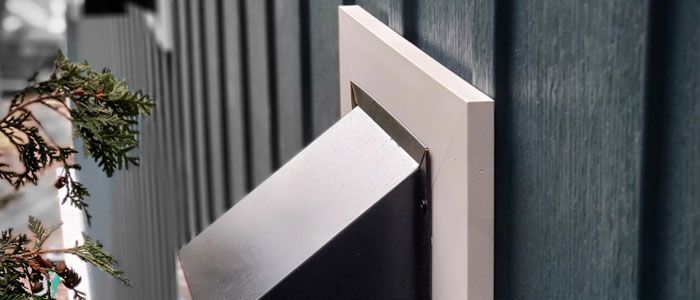 a close up of a vent on an exterior wall featuring a trim option