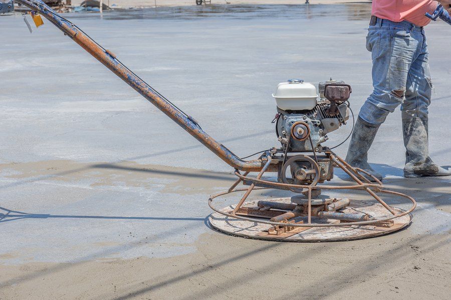 worker using the rotating trowel