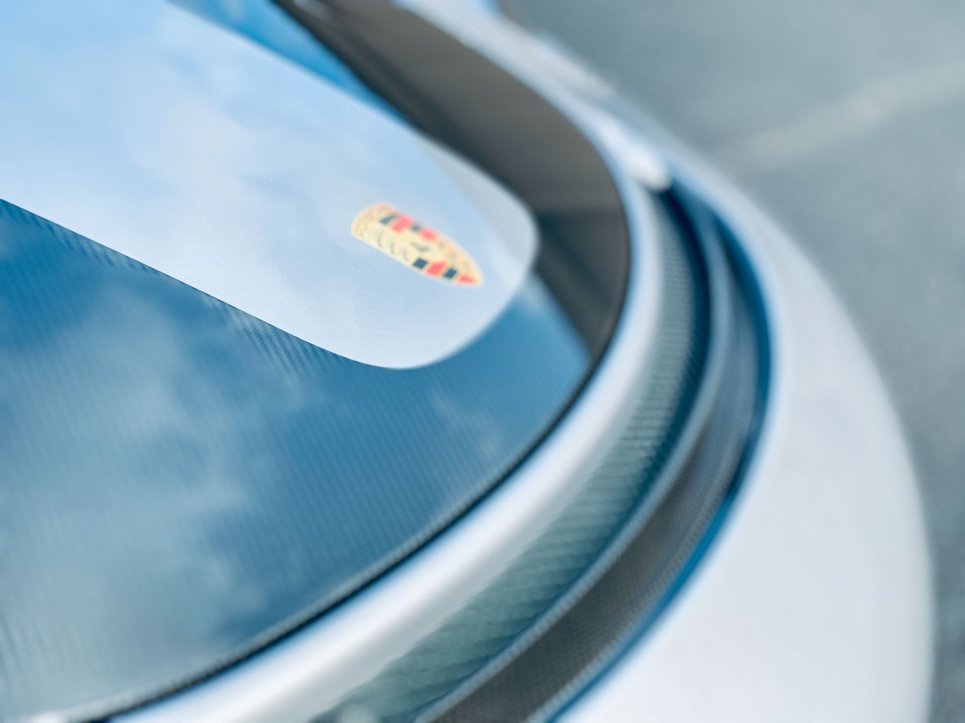 A close up of a car windshield with a sticker on it
