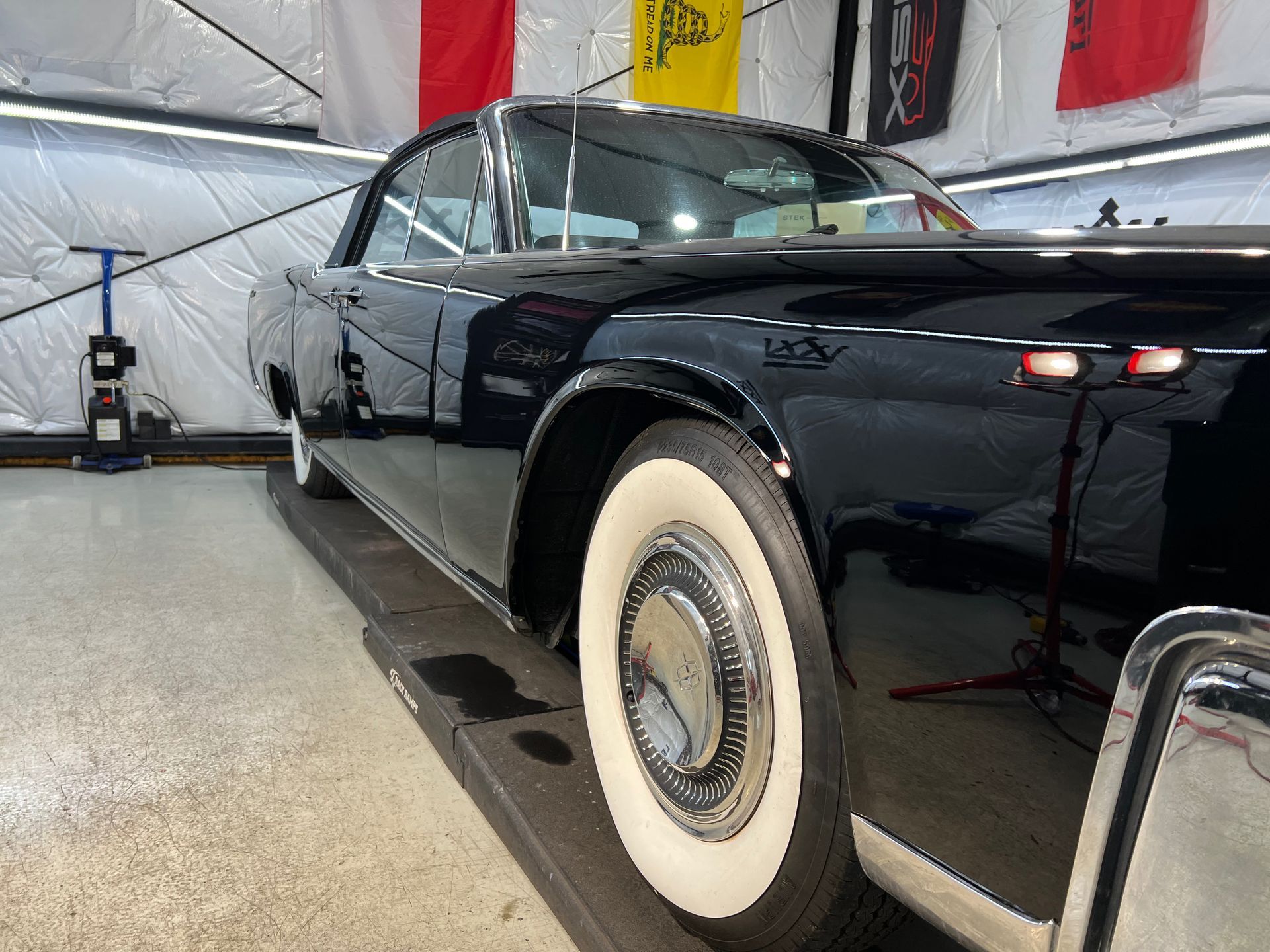 black car paint correction side view