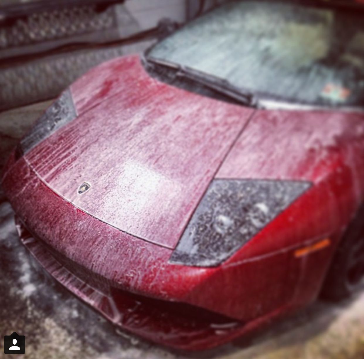 A red sports car with the letter o on the front