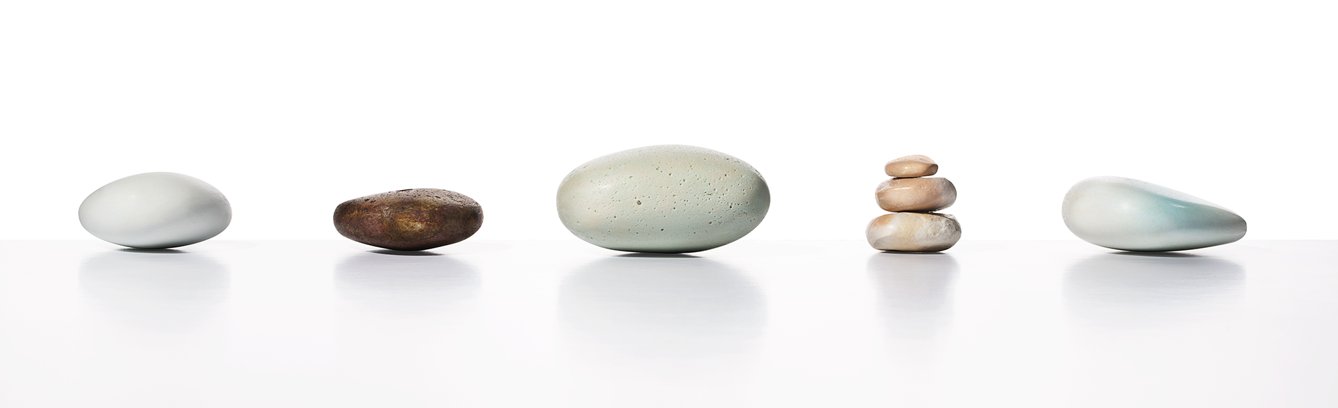 A row of rocks sitting on top of each other on a table.