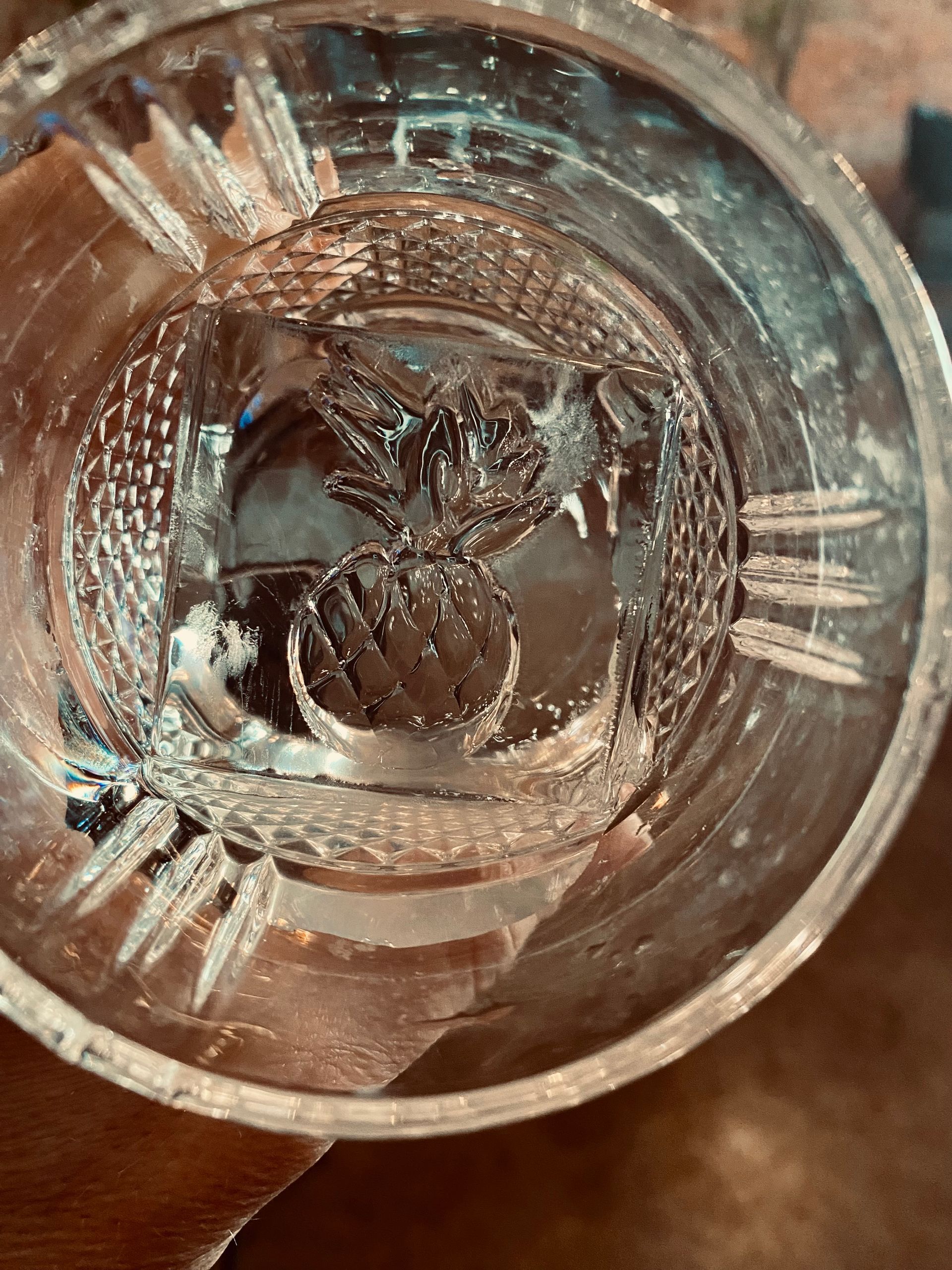 A close up of a glass bowl filled with water on a table.