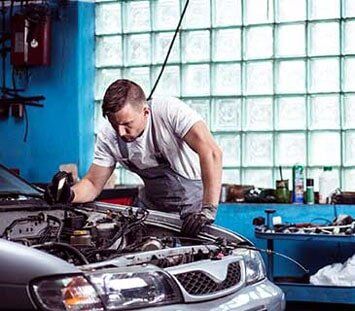 Mechanic Repairing the Car Engine - Auto Body Repair in Sardinia, Ohio