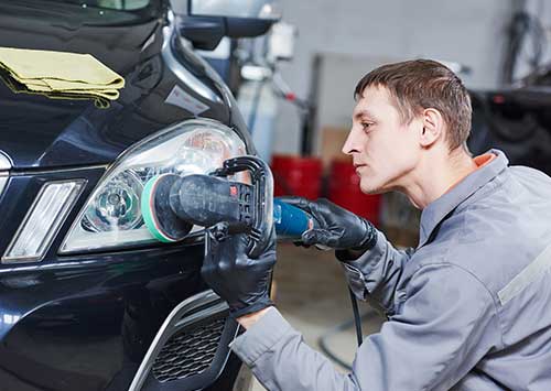Auto Mechanic Buffing and Polishing Car Headlight - Mechanic in Sardinia, Ohio
