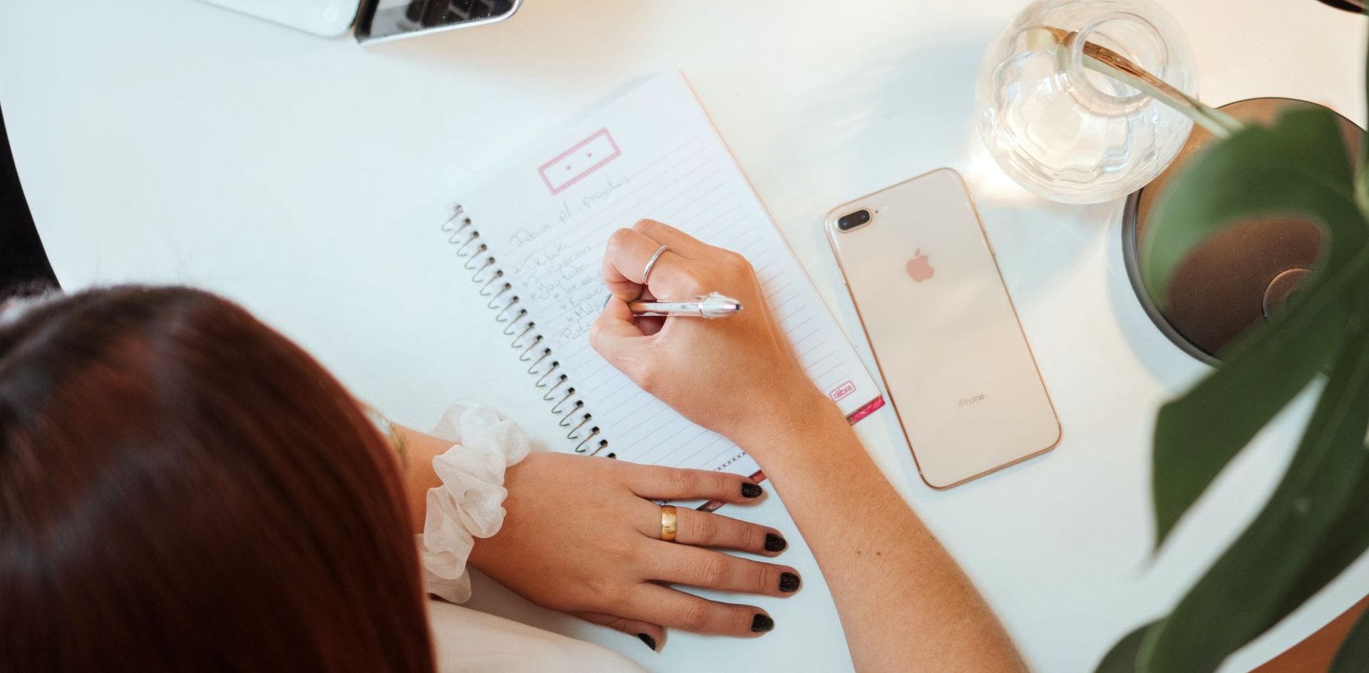 woman writing down things