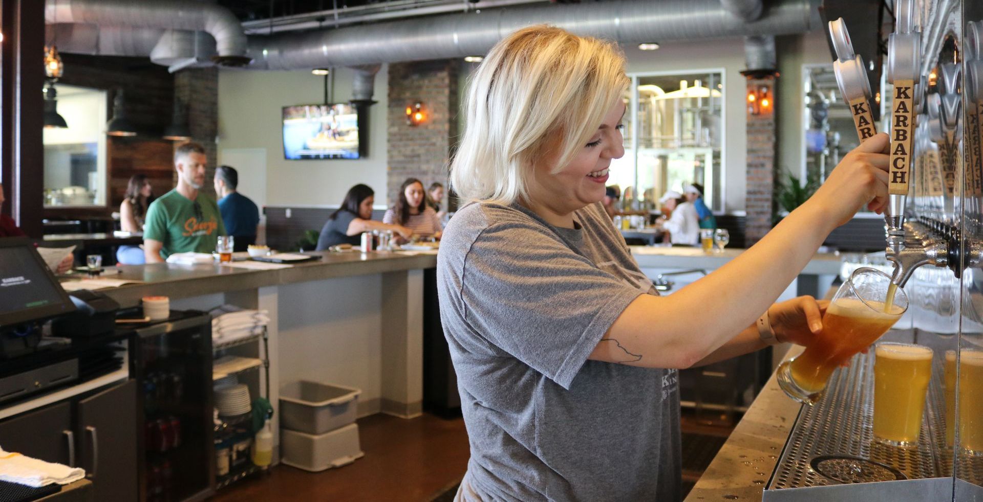 woman pouring beer