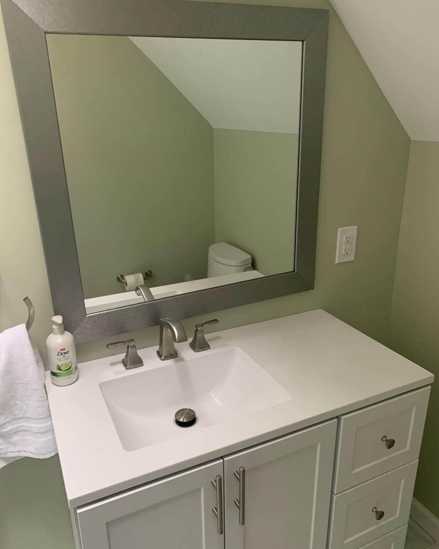 A set of wooden stairs leading up to a deck with a white railing.