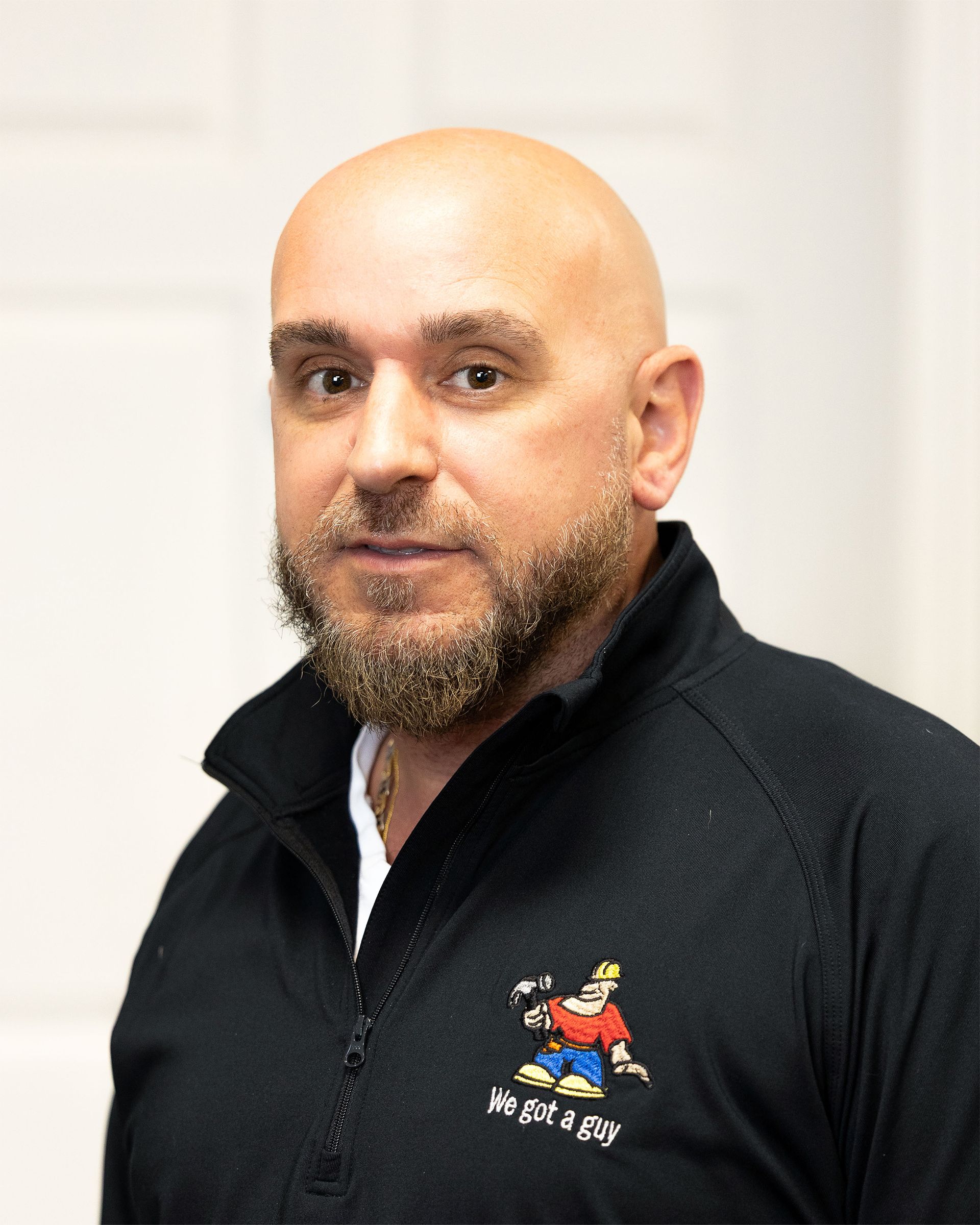 A cartoon man wearing a hard hat and a red shirt that says i 'm the guy