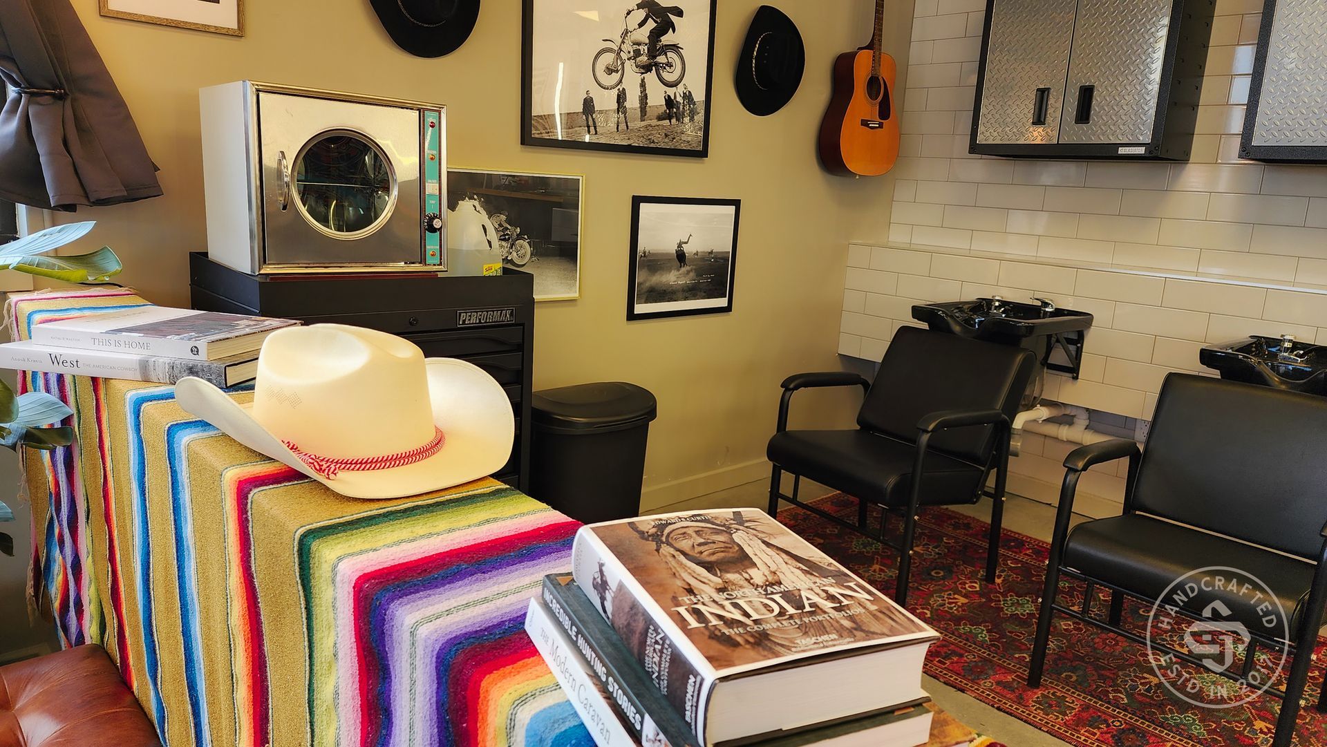 A cowboy hat is sitting on top of a table in a room.