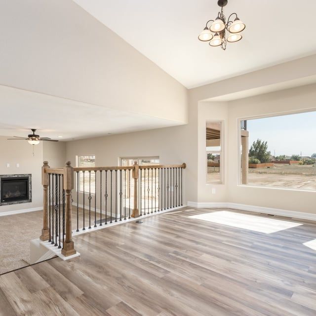 A living room with hardwood floors and a fireplace