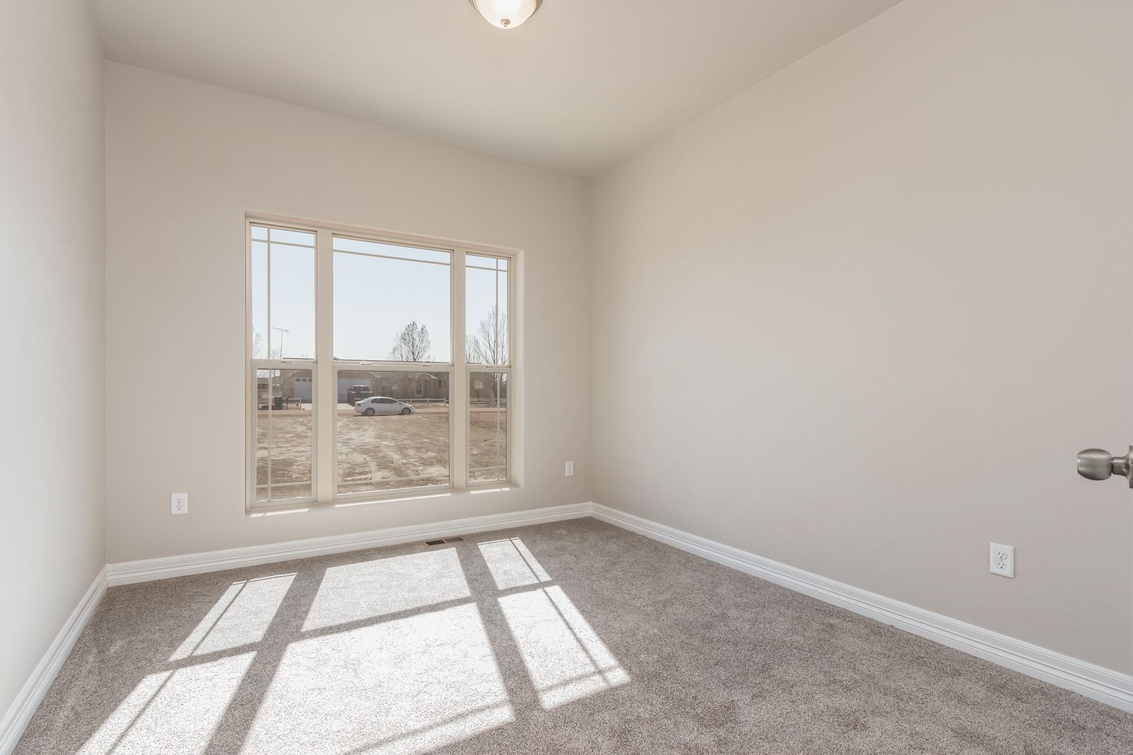 There is a large window in the middle of the room.