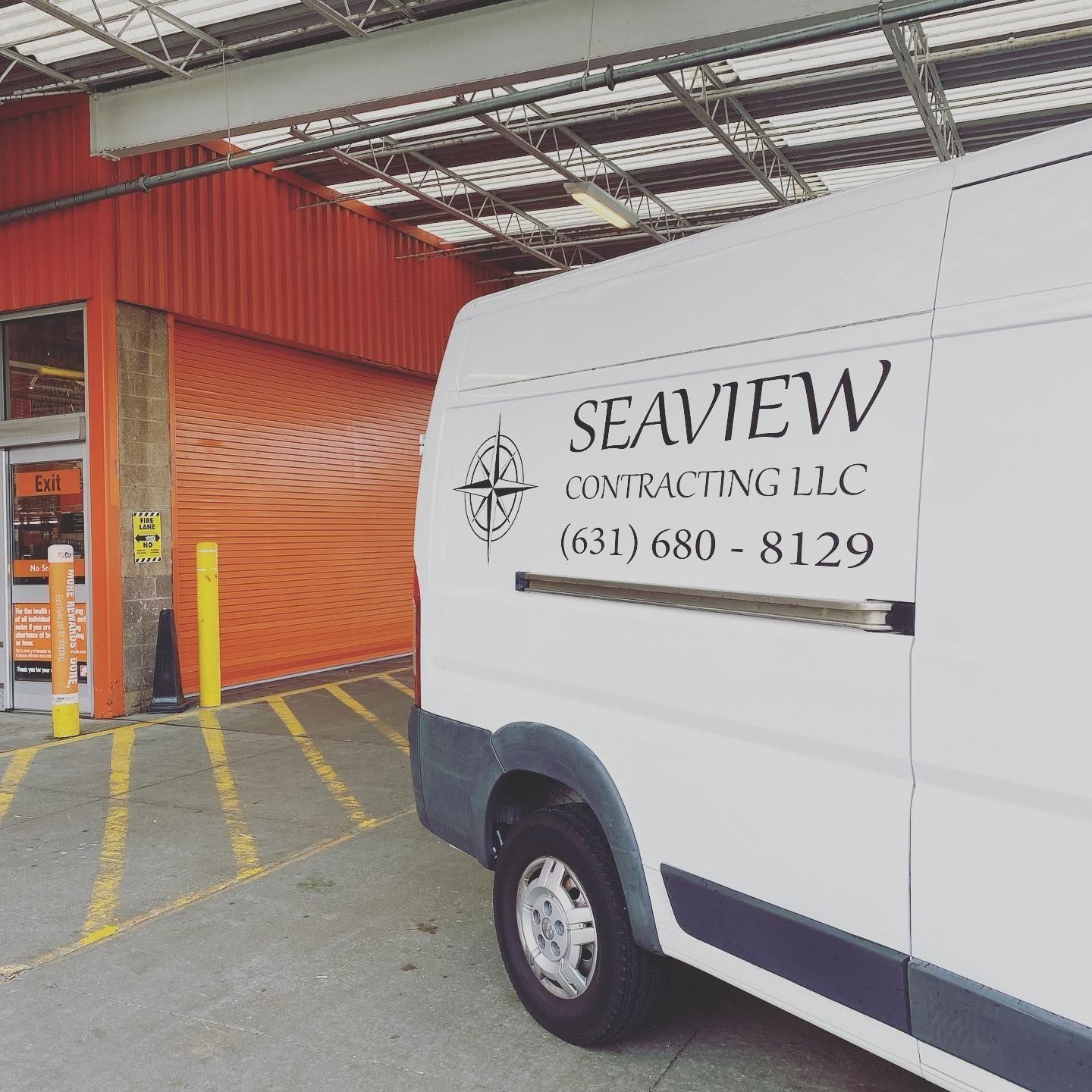 White Seaview Contracting van parked outside Home Depot store with orange loading dock.