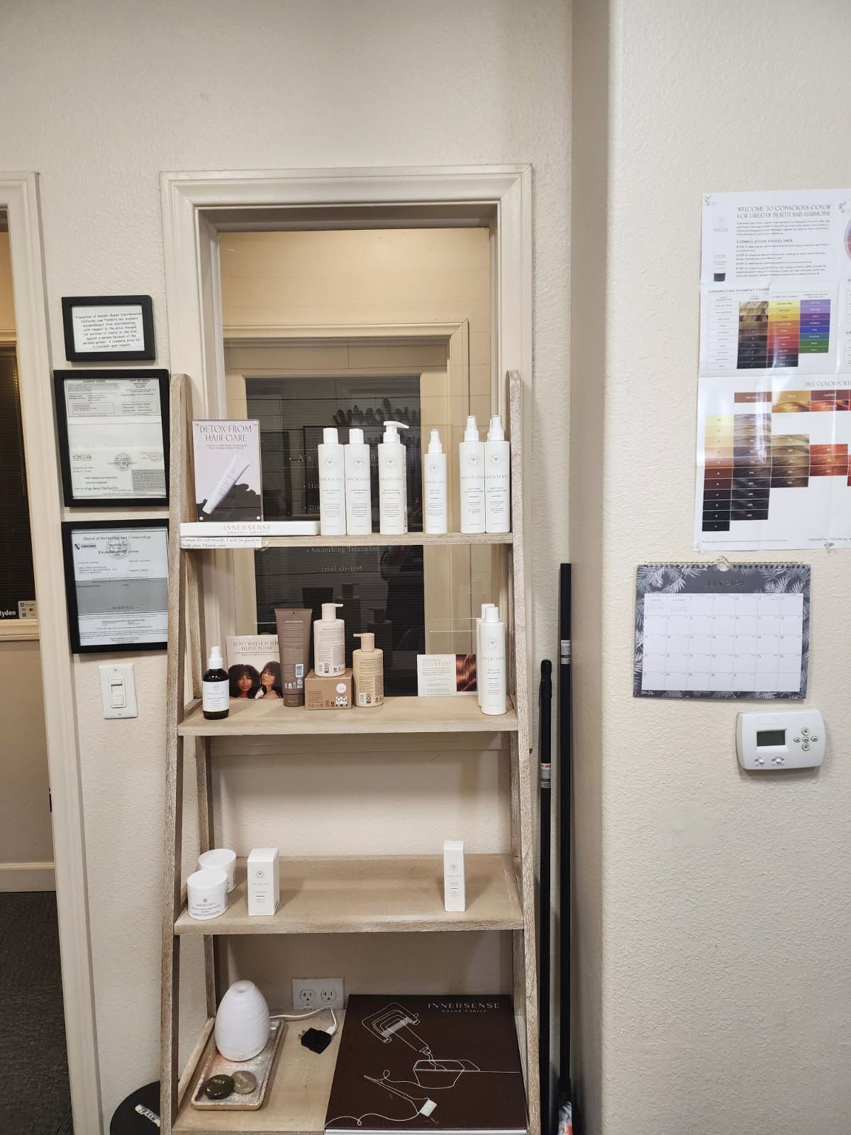 A shelf with a lot of bottles on it in a room.
