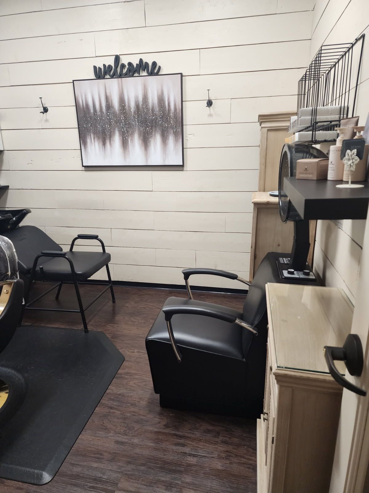 A salon with a sign that says welcome on it