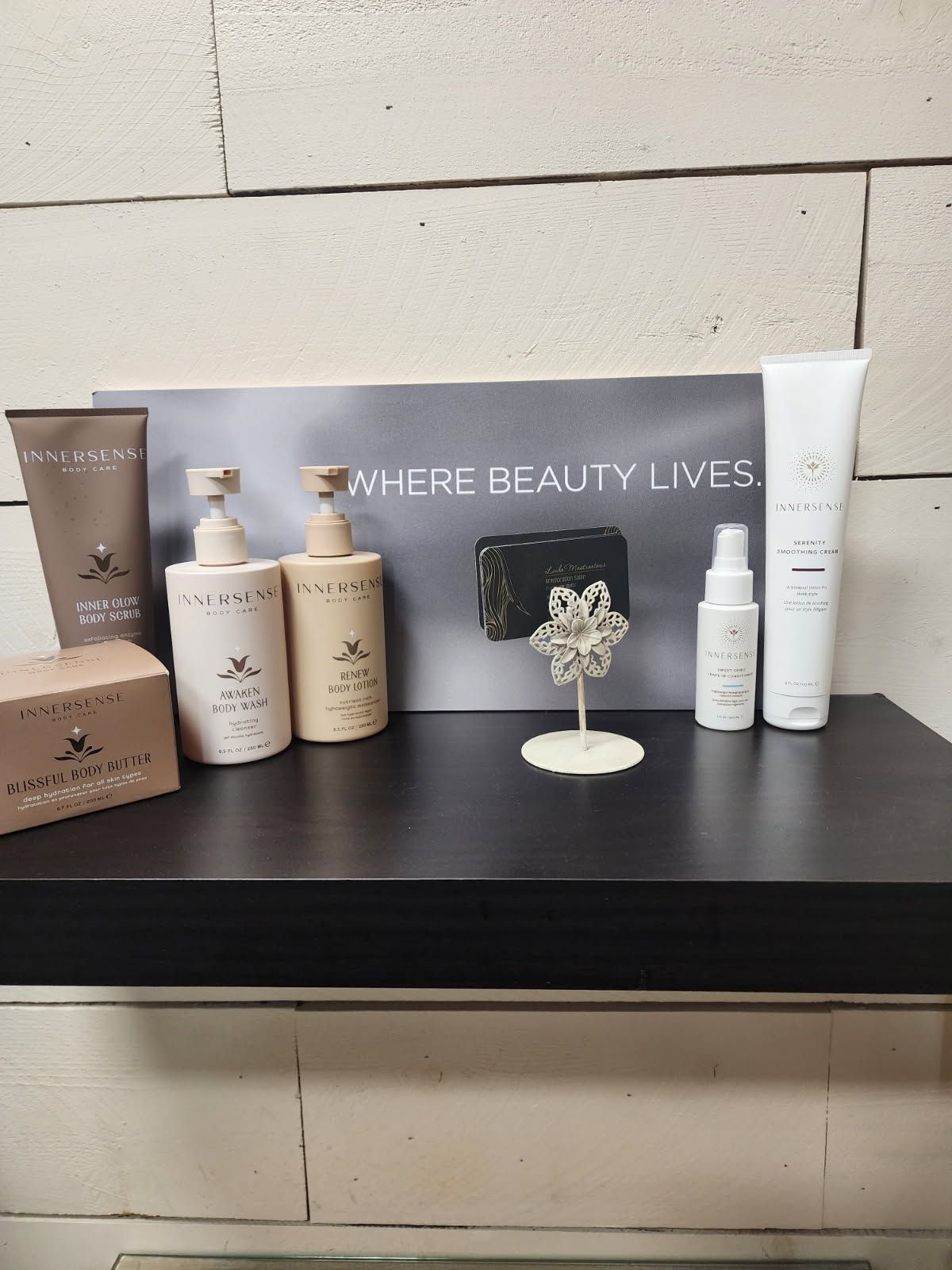 A shelf with a sign that says where beauty lives