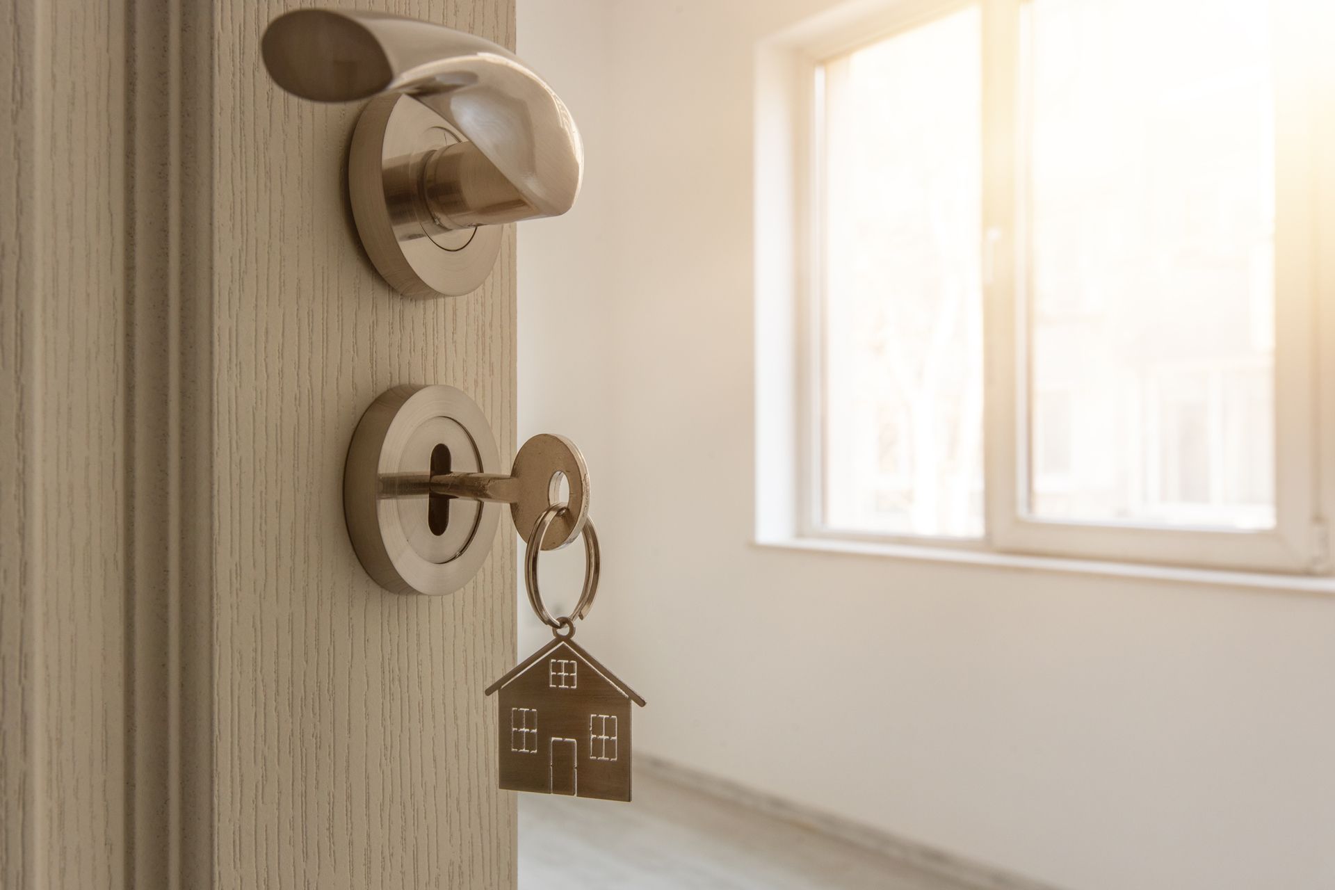 Apartment Door With Key and Home Shaped Keychain