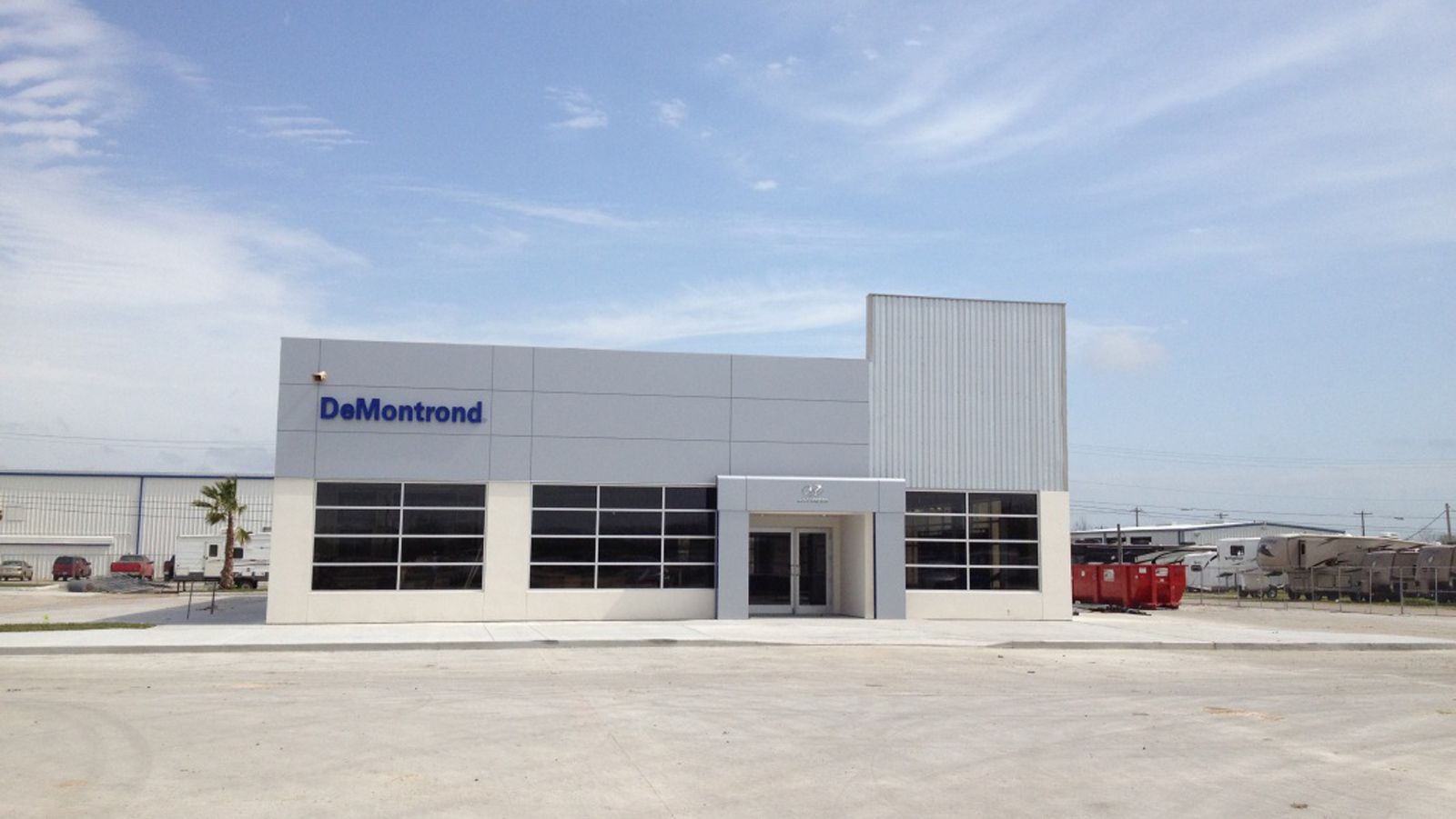 Modern light gray building with blue 