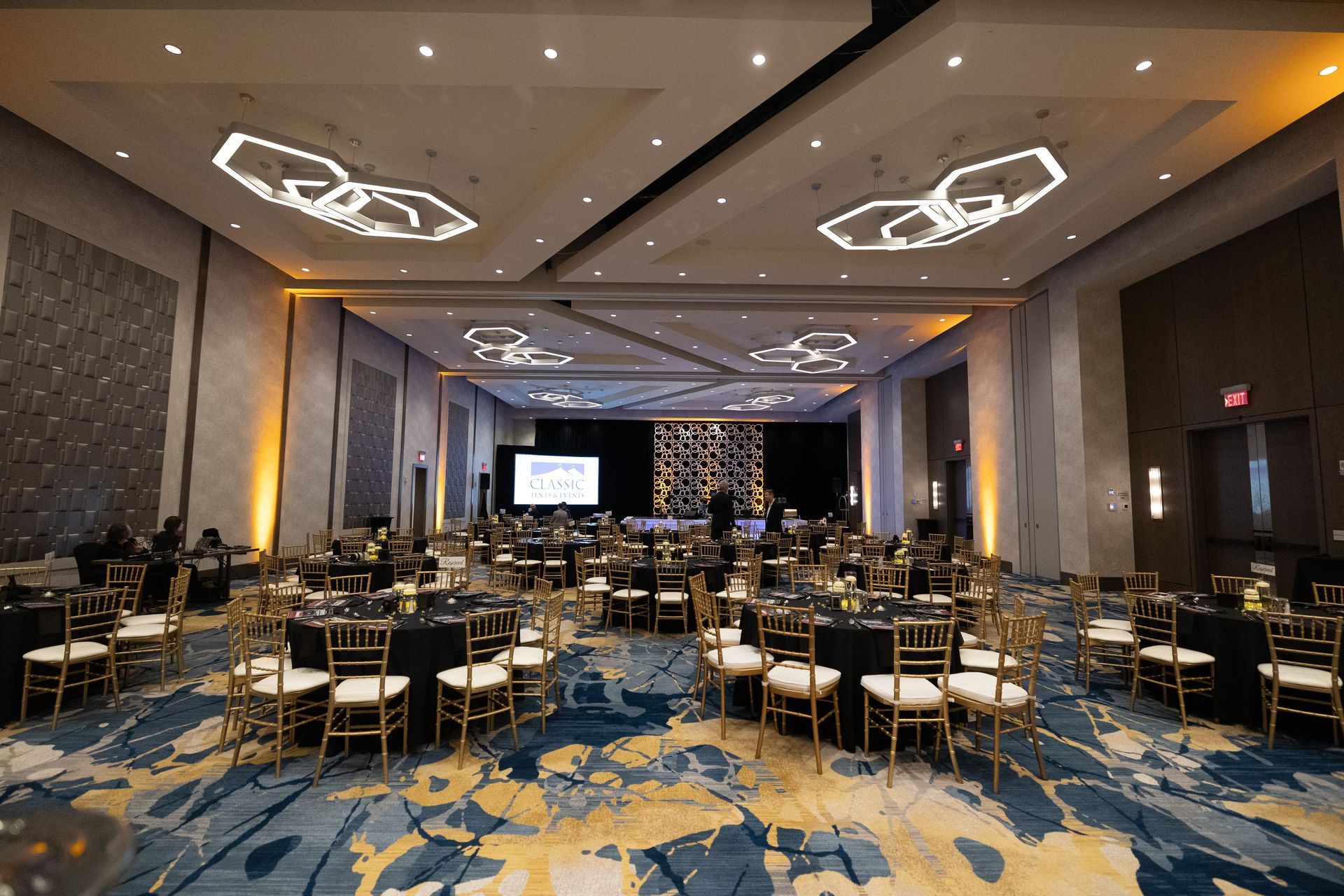 A large room with tables and chairs in it