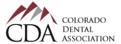 A logo for the colorado dental association with a mountain in the background.