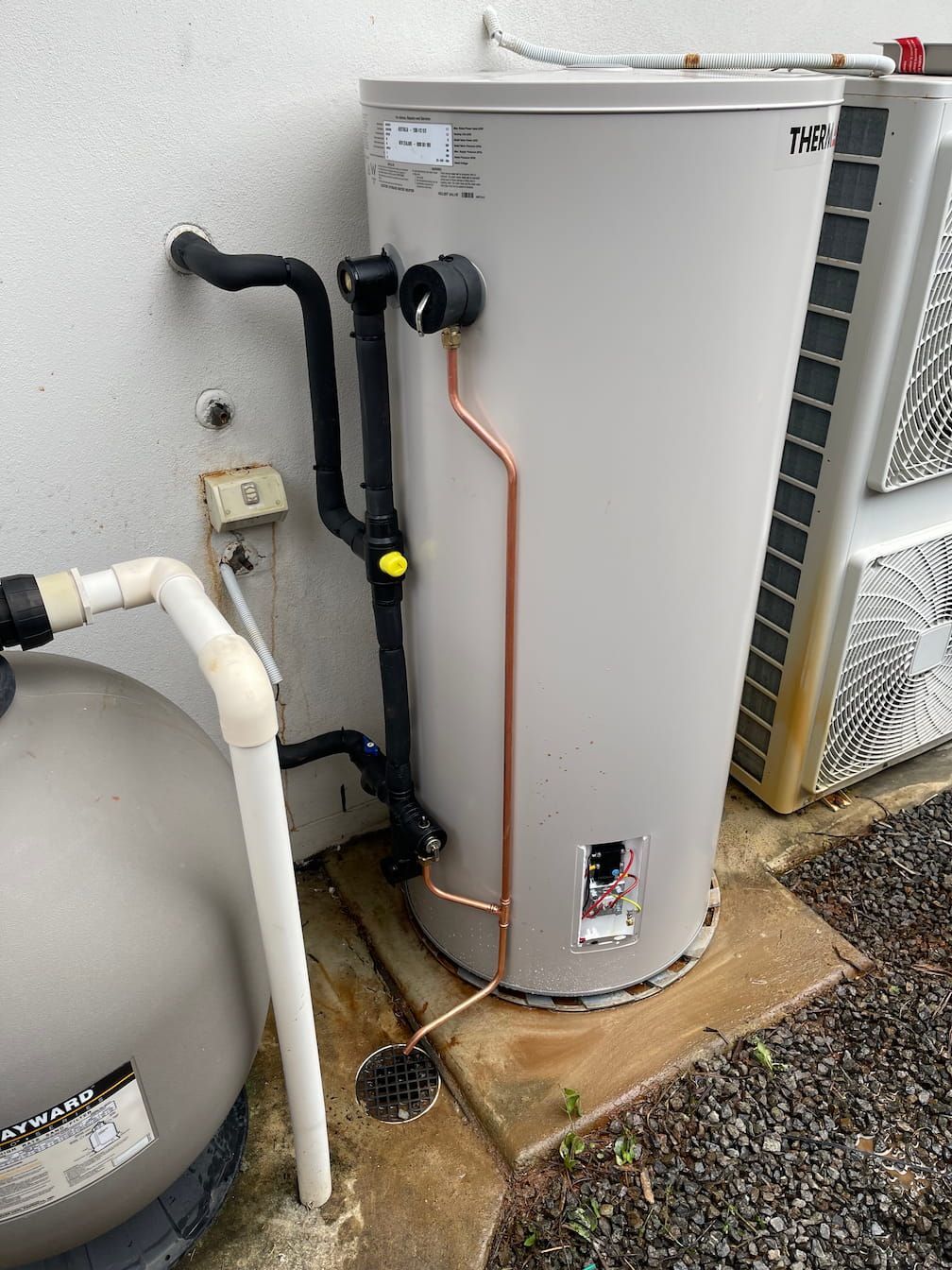 A thermostat being replaced on a hot water system on the Sunshine Coast