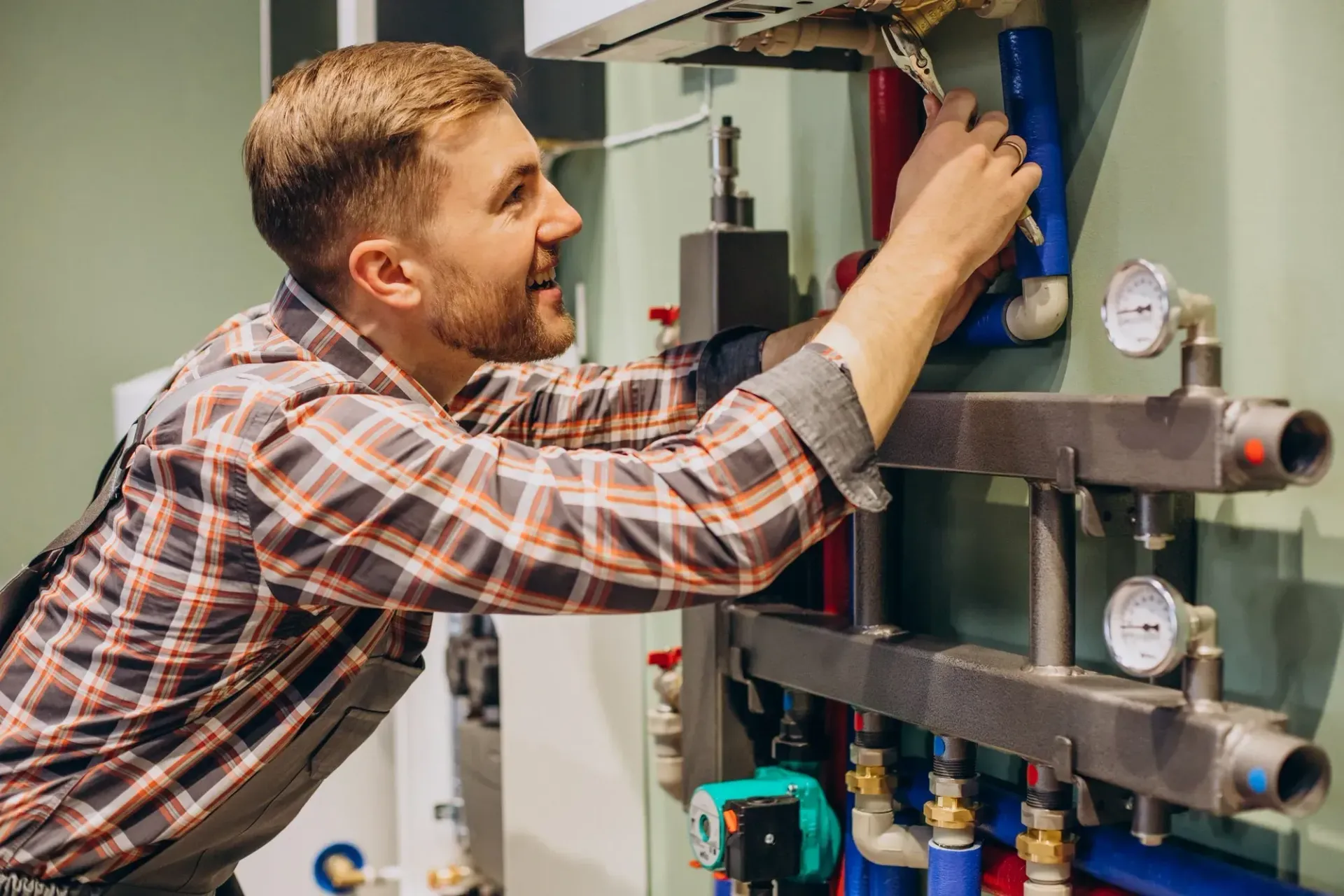 A gas fitter inspecting a gas appliance on the sunshine coast