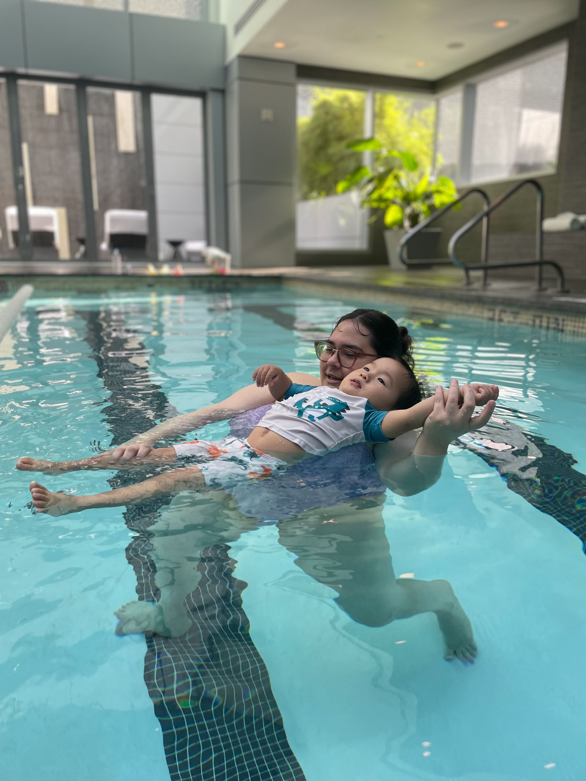 child learning backstroke