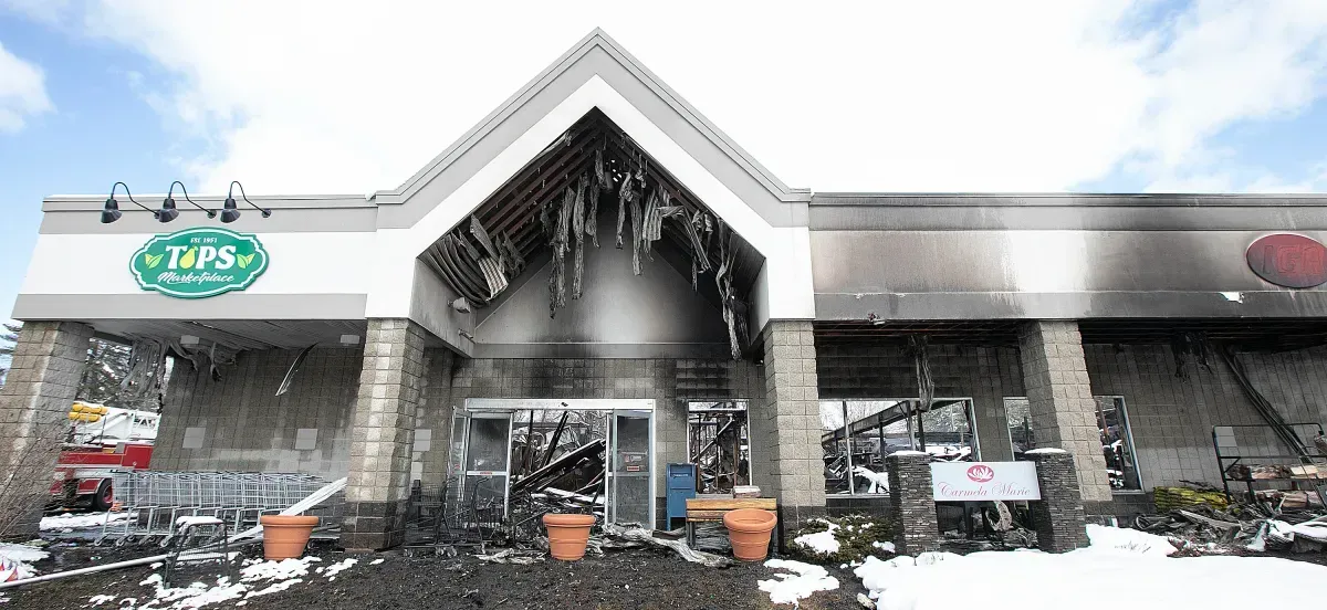A large building with a roof that has icicles hanging from it.
