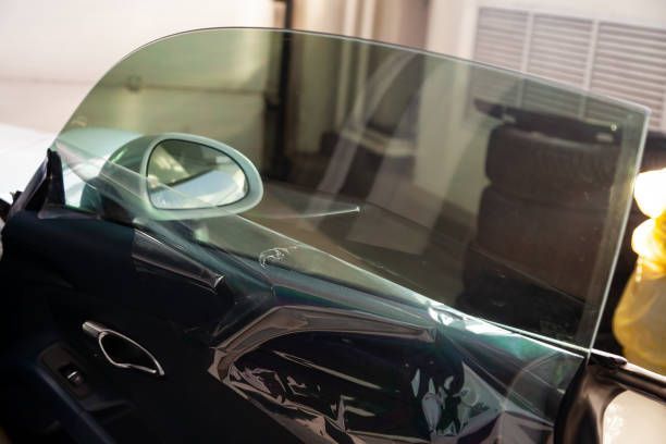 A close up of a car window with tinted glass.