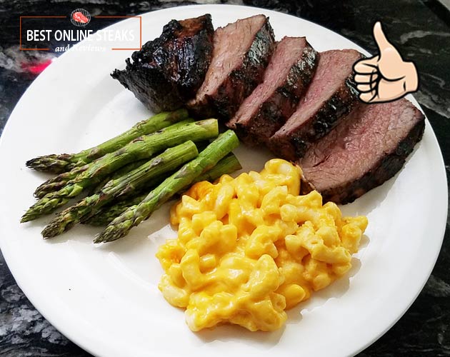Plated with Mac and Cheese and Grilled Asparagus. Almost a Bucket List Steak, it's that good!