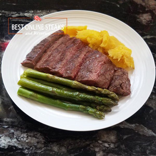 Center-cut Bavette steak plated with Acorn Squash and Asparagus