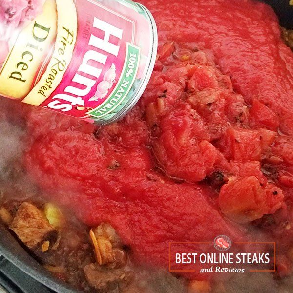 Add three cans of Hunts Fire-Roasted Tomatoes.