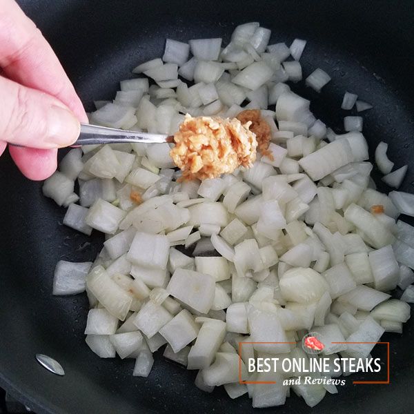 Put about this much finely chopped garlic into the pot. It can be fresh, frozen, or jarred.